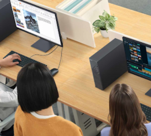 A group of people sitting at a desk