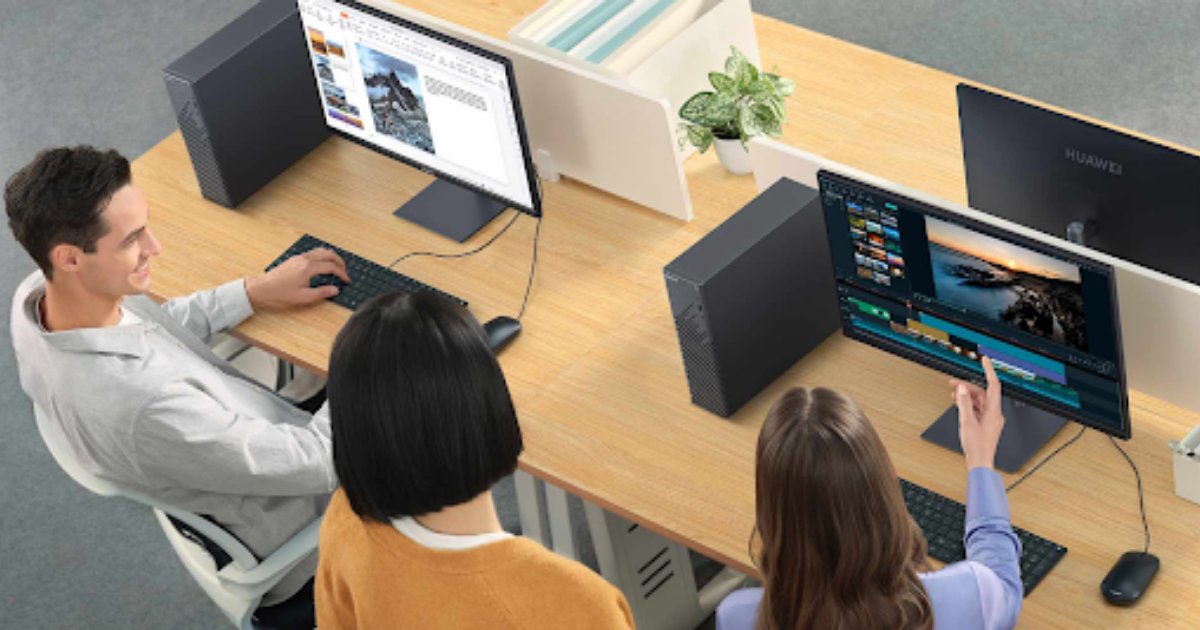 A group of people sitting at a desk