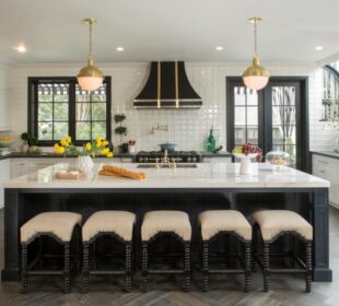A kitchen room filled with furniture
