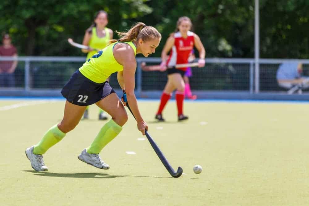 A group of people playing hockey