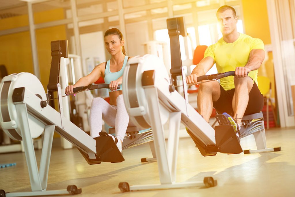 A boy and girl doing workouts in gym